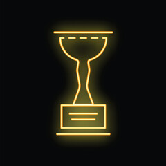 Poster - Yellow neon sign in the shape of a trophy cup is glowing on a black background