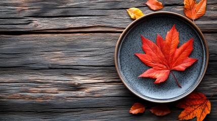 Wall Mural - Happy Thanksgiving Day. Festive Empty plate and autumn leaves on a rustic wooden table and space for text on wood background,