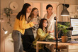 © Pixel-Shot - Team of female programmers working in office at night