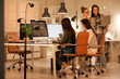© Pixel-Shot - Group of female programmers working in office at night