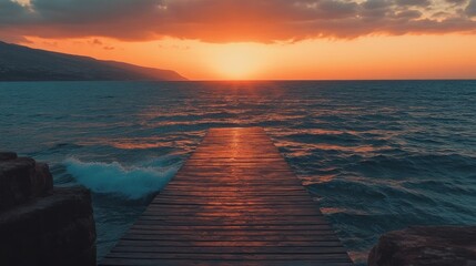 Wall Mural - Serene sunset over a wooden pier extending into the ocean, creating a tranquil atmosphere.