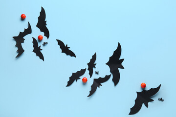 Sticker - Paper bats with spiders and pumpkins for Halloween party on blue background