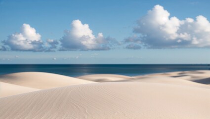 The foreground is dominated by smooth, light beige sand with gentle undulations, creating a sense of calm and tranquility