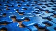 © Vibrant Visions Pixe - A close-up of interlocked blue puzzle pieces, showcasing the intricate design and the concept of unity and connection