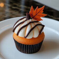 Wall Mural - Autumn-themed cupcake with maple leaf decoration