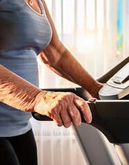 senior people doing exercises in gym to stay fit