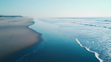 Wall Mural - Serene coastal view with gentle waves lapping on a tranquil beach.