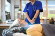 © Prathankarnpap - Physiotherapist doing Reiki treatment session to mature woman at clinic. Alternative medicine concept