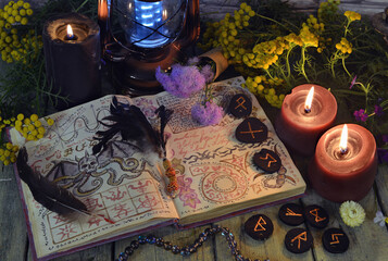 Wall Mural - Mystic still life with book of spell, runes and witchy ritual objects on old altar table. Occult, esoteric, wicca, Halloween and gothic concept. No foreign language, all symbols are fictional