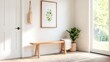 © akarawit - A sunlit entryway featuring a wooden bench adorned with a cozy blanket, elegant wall art, and a vibrant potted plant creates a welcoming, serene atmosphere perfect for relaxation.