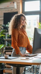 Poster - A woman is sitting at a desk with a computer monitor in front of her