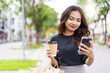 © DG PhotoStock - Asian businesswoman walking on the street in city.