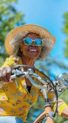 Aufkleber - A woman wearing a yellow shirt and a straw hat is riding a bicycle
