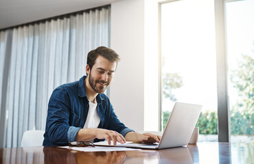 Businessman, laptop and documents for remote work, communication and development in home office. Project management, technology and paperwork in house for budget proposal, progress report and kpi