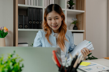 Wall Mural - a businesswoman is working in her office, an entrepreneur works on new project in a workplace, a female employee is working in big company in her nice office, strategy and idea