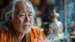 © SakdaSong - Senior Man Participating in Spiritual Ceremony at Temple
