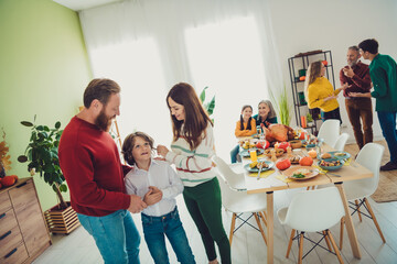 Photo of friendly sweet family eating thanksgiving holiday dinner spend time together take care little son smiling indoors house room