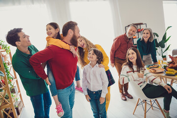 Canvas Print - Photo of attractive cheerful big full family play together piggyback meeting eating holiday dinner good mood having fun at home indoors