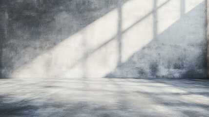 Poster - Sunlight casting shadows on a textured concrete wall in an empty industrial space