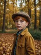 © Tamazina - Young Caucasian boy with red hair and freckles, wearing gray newsboy cap, yellow jacket, and plaid scarf, standing in forest with autumn foliage in background