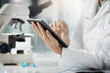 © BestCam/peopleimages.com - Hands, scientist and person with tablet in lab for medical research, experiment solution and health innovation. Expert, digital and investigation results, pharmaceutical report and vaccine discovery