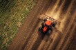 © Artstudio - Bird s eye view of a tractor cultivating and spraying a field
