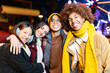 © Xavier Lorenzo - Multiracial group of young people smiling at camera standing together outdoors. Happy millennial friends enjoying winter vacation
