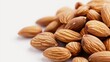 © Yusif - A collection of almonds is displayed against a clean white background, showcasing their natural beauty and variety.