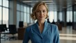© Alteisen Riese - twenties caucasian woman in blue attire on office background model portrait looking confident for ad concept space for text