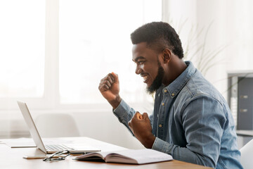 Poster - Business Success. African American Businessman Celebrating Victory At Work, Clenching Fists In Excitement, Free Space
