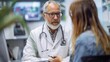 © Attasit - A senior doctor consulting with a patient in a healthcare facility, providing professional advice.