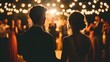 © Jirapron - Couple enjoying a romantic moment at a beautifully lit wedding reception.