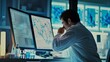 © VK Studio - In a high-tech lab, a scientist intensely studies data on dual monitors displaying intricate graphical information and charts, immersed in analysis.