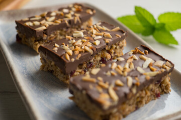 Homemade energy bars made with oats, nuts and chocolate.