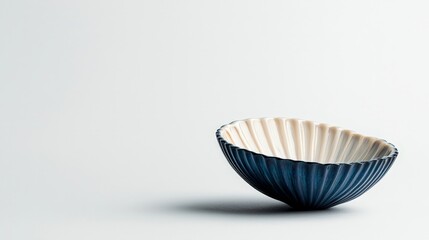 Serenity in Blue Closeup of Elegant Ceramic Bowl on White, Minimalist Background - Tranquil Home Decor Concept