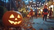 © Enigma - Carved pumpkin with a glowing candle sits on a path covered with autumn leaves as costumed children trick or treat on halloween night