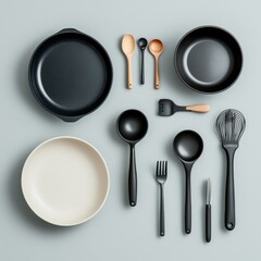 A collection of modern kitchen utensils and cookware arranged neatly, showcasing elegant design and functionality.