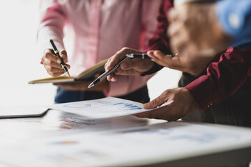 Wall Mural - Data analysis, marketing strategy or statistics by business development leaders planning company growth. Hands of finance managers in a meeting discussing about financial performance in office.