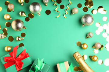 Sticker - Flat lay composition with confetti and bottle of sparkling wine on green background, space for text. Christmas decor