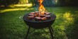 © Jane Studio - A charcoal grill with flames licking up the sides as it cooks juicy burgers on a sunny day