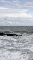 Wall Mural - The sky is overcast and the ocean is stormy