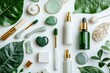 © Nattadesh - Stylish flat lay of skincare products surrounded by lush greenery and natural elements for a fresh, organic aesthetic.