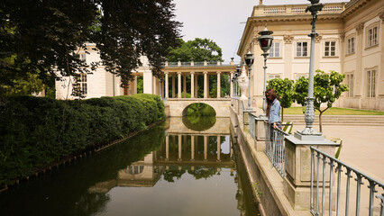 Warsaw, Poland. Royal Baths Park and a girl admiring nature