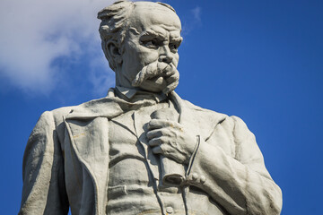 Monument to the famous Ukrainian poet and writer  T. G. Shevchenko, cultural and historical heritage of Ukraine. Color horizontal photo with blue sky background.