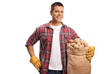 Canvas Print - Young farmer holding potatoes in a sack