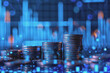 © PHAISITSAWAN - Blue financial graphs and charts with coins show business growth and investment market profits.