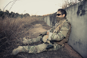 Portrait of soldier shooting during the military operation in the bunker vintage style,Action shooting the enemy