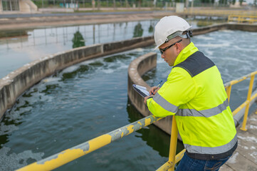 Wall Mural - Environmental engineers work at wastewater treatment plants,Water supply engineering working at Water recycling plant for reuse