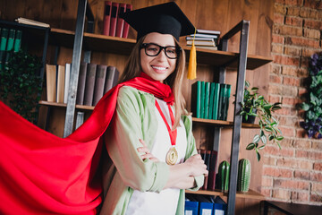 Photo of adorable positive lady student wear shirt mortarboard arms crossed indoors university library