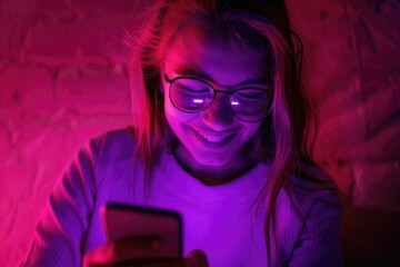 Canvas Print - A woman is focused on her cell phone, likely checking messages or browsing